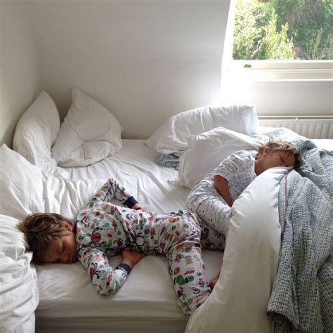 step mom sharing bed|Step mommy and stepson share a bed in a hotel room .